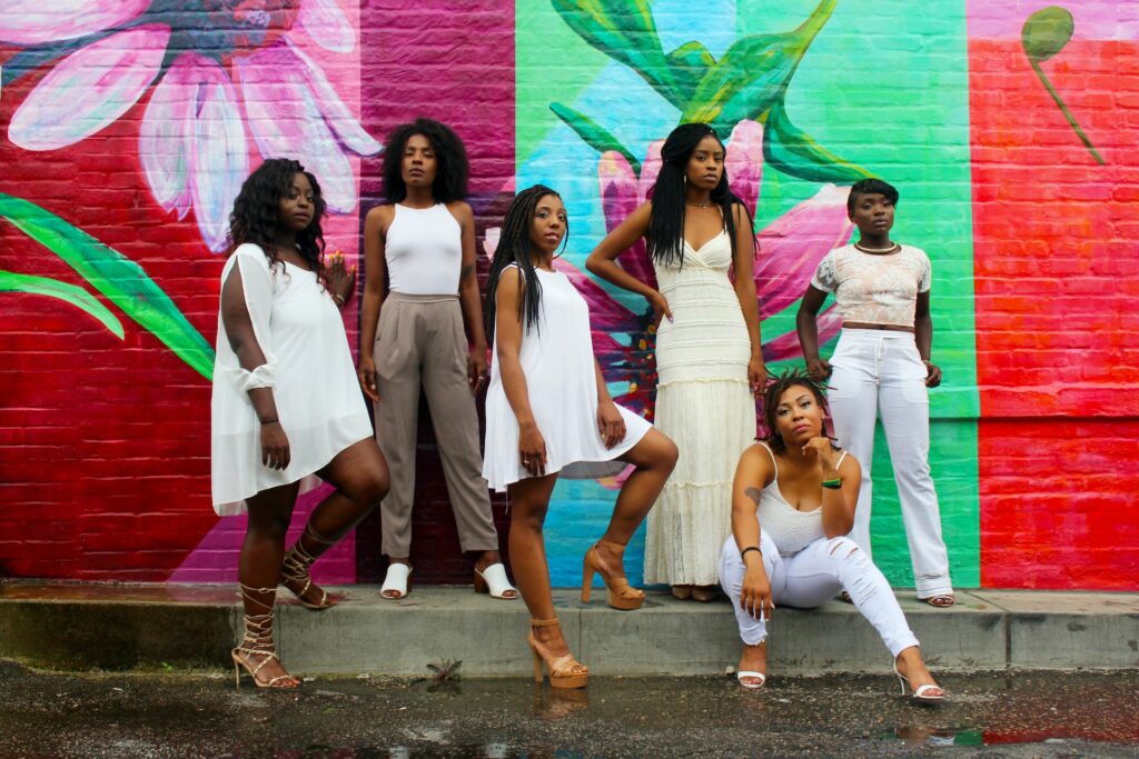 Women posing for a group photo for TikTok.