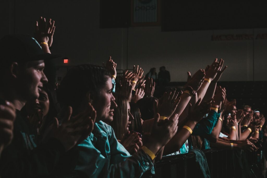 An audience clapping their hands.