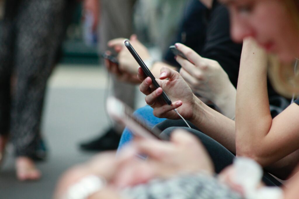 People watching TikTok videos on their smartphones.
