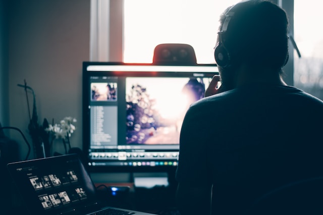 A person editing a video on a computer.