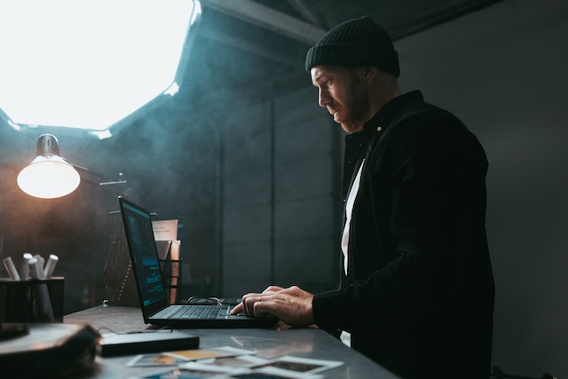 A man working on a laptop.