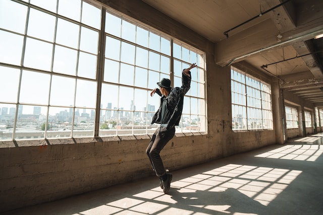 A man dancing in an empty office.