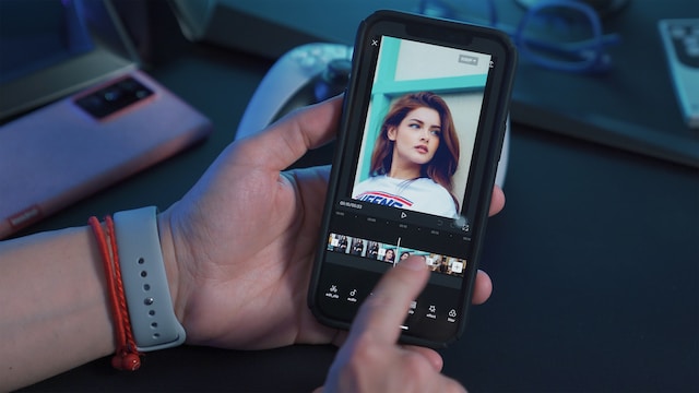 A person editing a video on the phone.