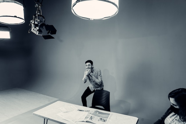 A man performing in front of a camera.