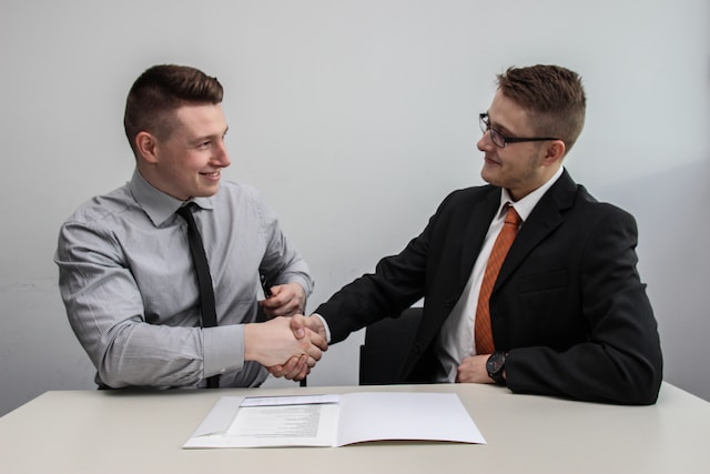 Two men shaking hands.