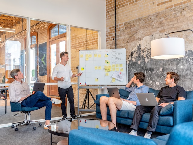 A group of men having a meeting.