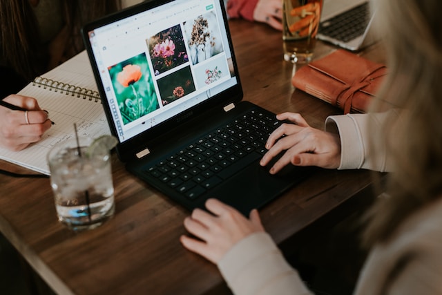 A person editing photos on a laptop.
