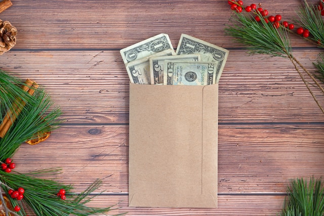 Dollar bills inside a brown envelope.