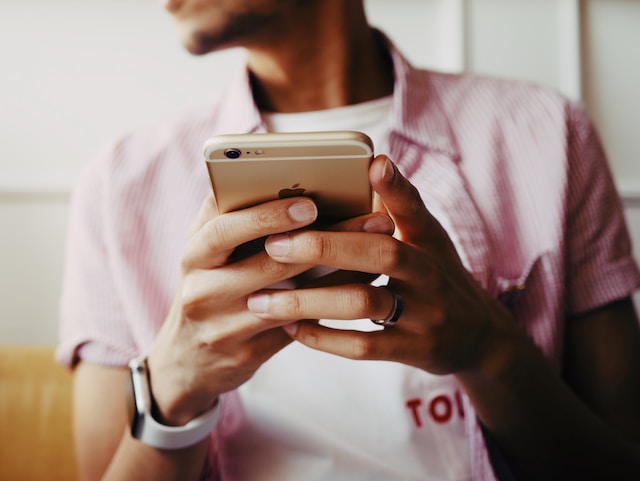 A person holding an iPhone.