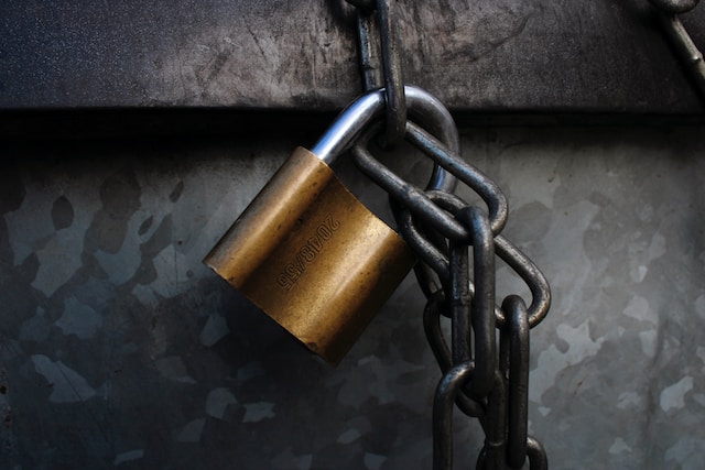 A padlock attached to a chain.