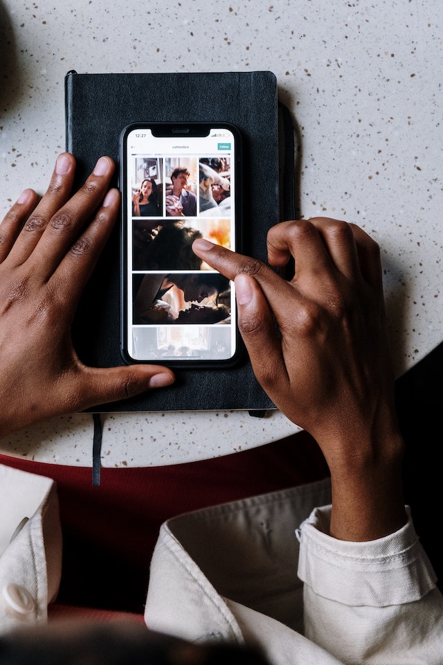 Someone scrolling through TikTok on their smartphone.