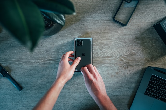 A TikTok influencer unboxing a new iPhone model he wants to review.