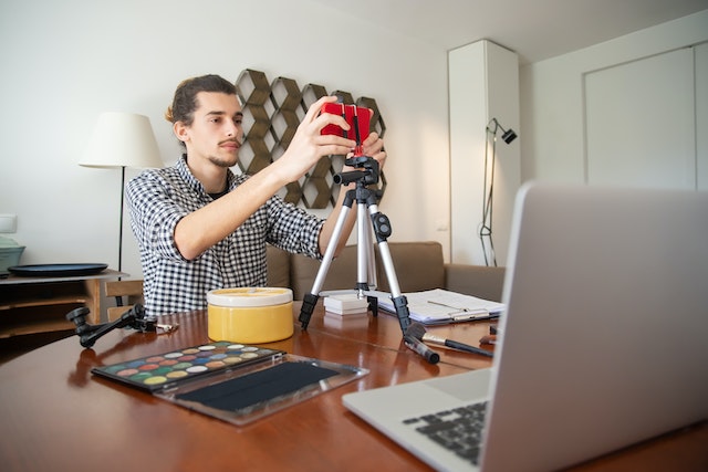 A man getting ready to do vlogging for TikTok.