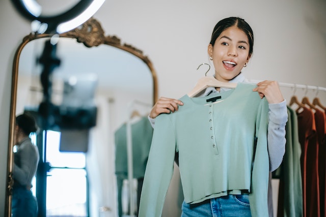 A girl showing off her new clothes for a TikTok video.