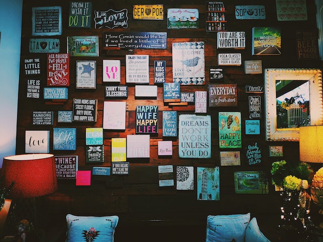 Framed quotes hang on a wall.