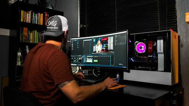 A picture of a man editing a video for TikTok and other social platforms.