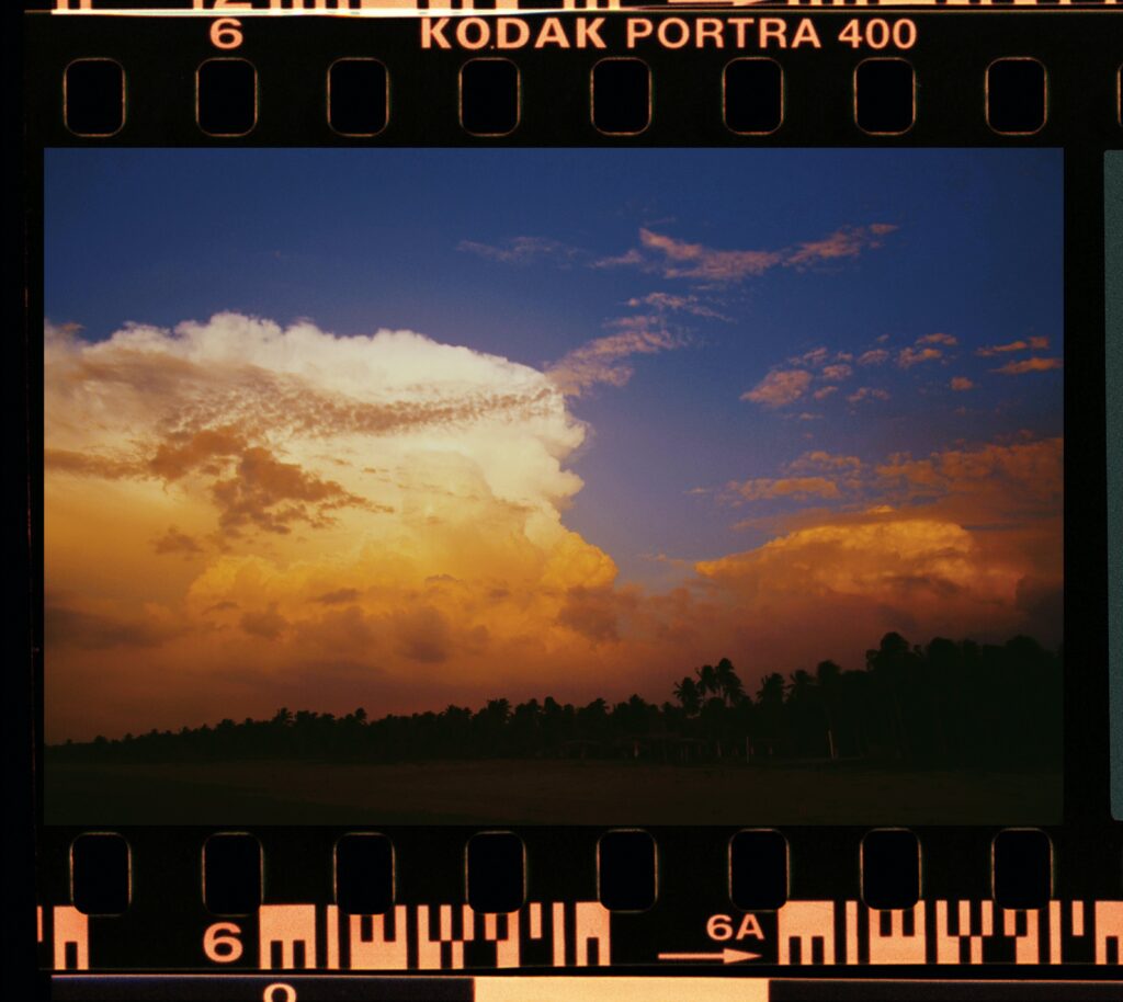 An image of clouds tinted orange during sunset.