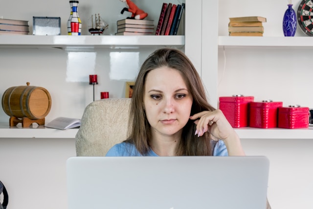 A woman works on TikTok issues using her laptop.
