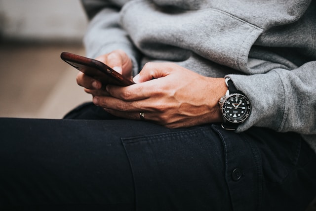 A person browses online on their phone.