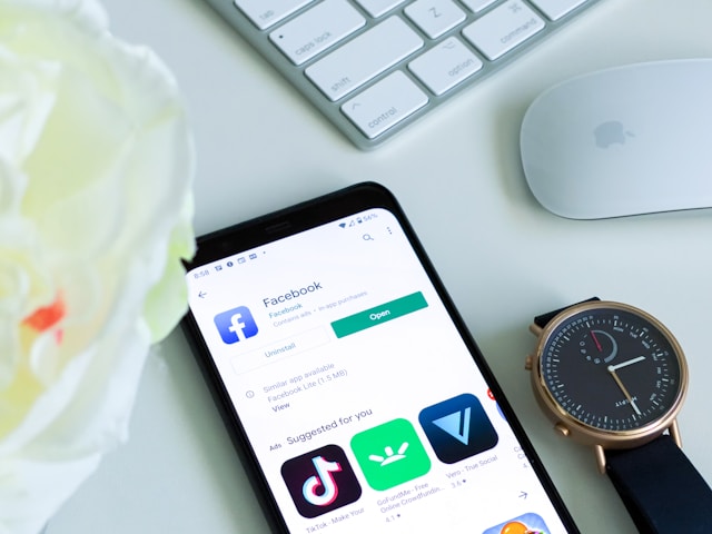 A phone screen shows several social media apps available for download.