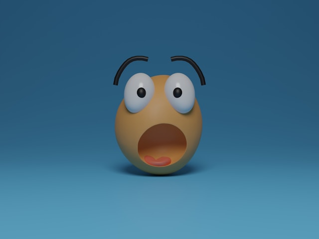 A 3D yellow emoji with a surprised face.