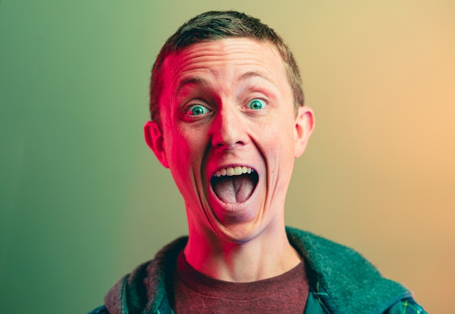 A man sports an open-mouthed smile for his TikTok PFP.