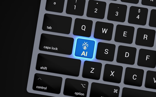 A laptop keyboard shows a single blue key that says “AI.”