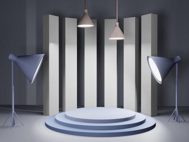 Two spotlights are set up in front of a round stage.