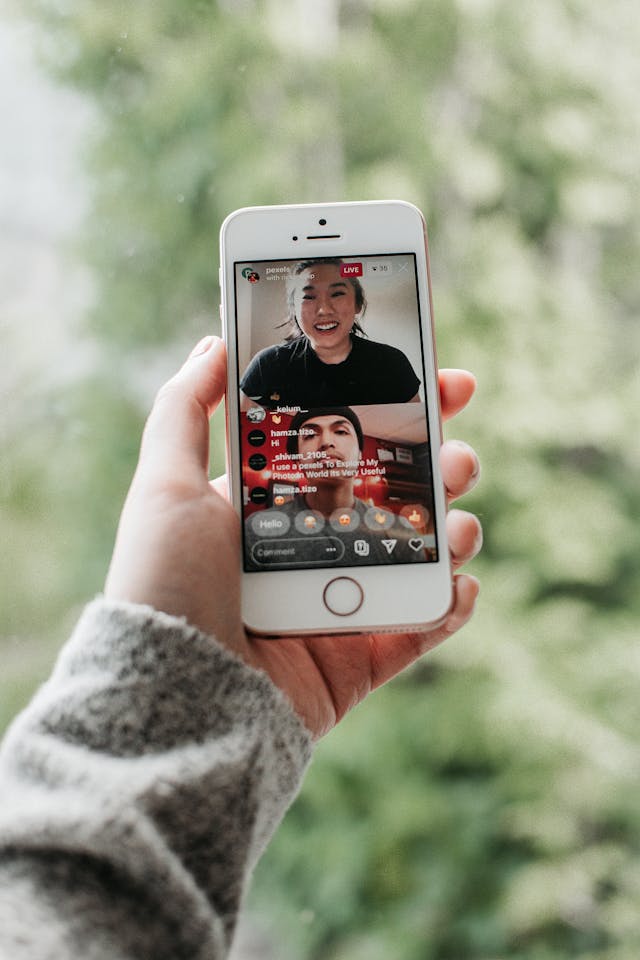A phone shows two creators interacting on a livestream.