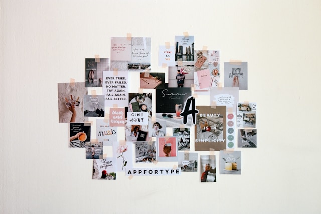 A white wall is filled with a collage of pictures.