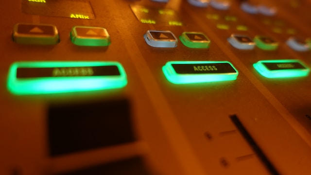 An analog control panel shows a green access button.