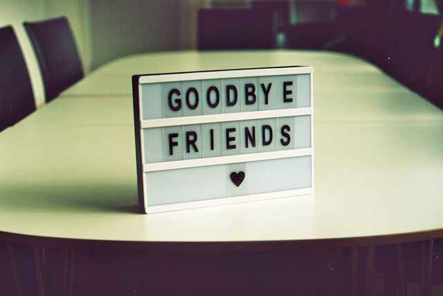 A sign on a table says, “Goodbye friends.”