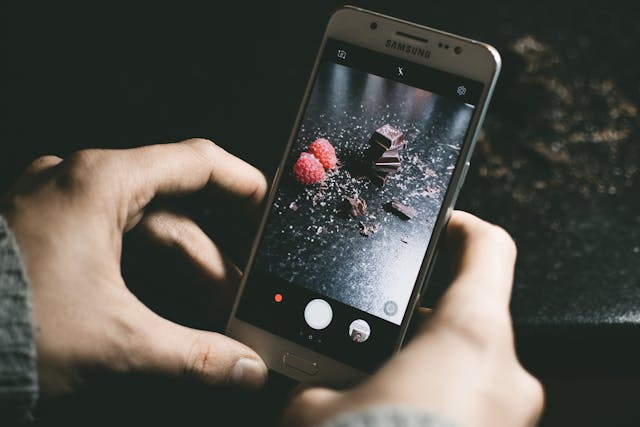 A person records a video of a chocolatey dessert.