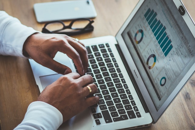 A person reviews TikTok for Business analytics on their laptop