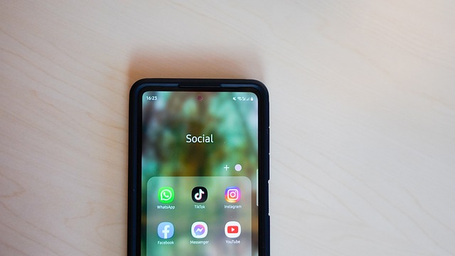 A mobile device shows a social media apps folder containing TikTok and other apps.