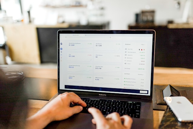 A person checks their TikTok metrics on a laptop.