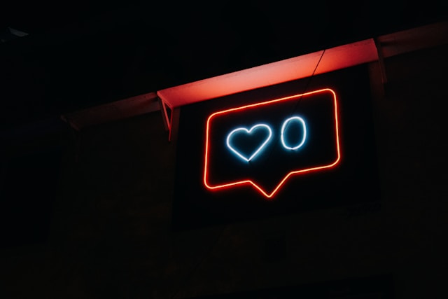 A neon light design of the TikTok like icon.