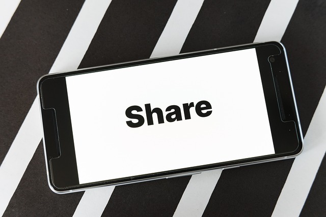 A mobile screen with the word “Share” on its screen.
