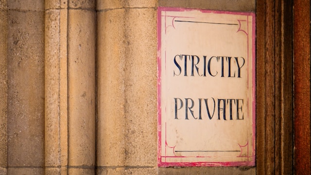 A sign outside a building says “Strictly Private.”