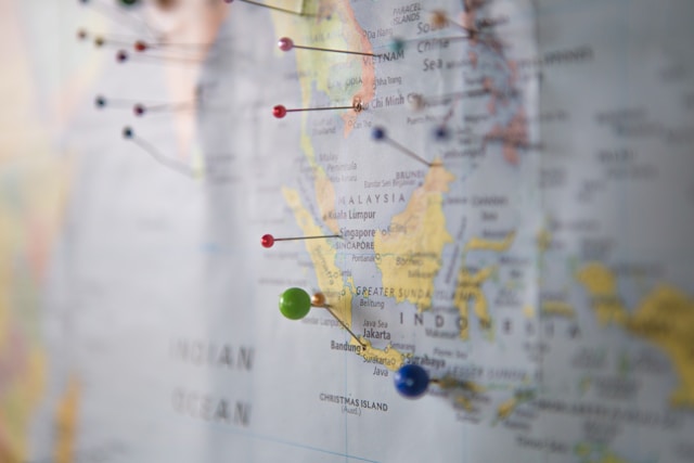 A map with different colored pins marking multiple locations.