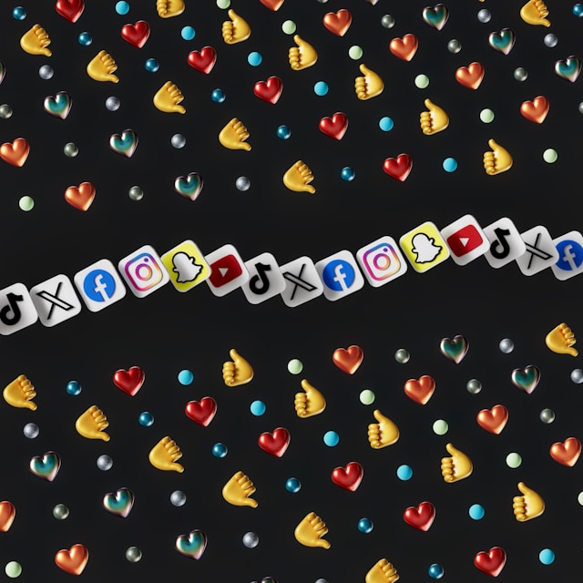 A screen displays numerous social media reach emojis and the logos of popular social media apps.