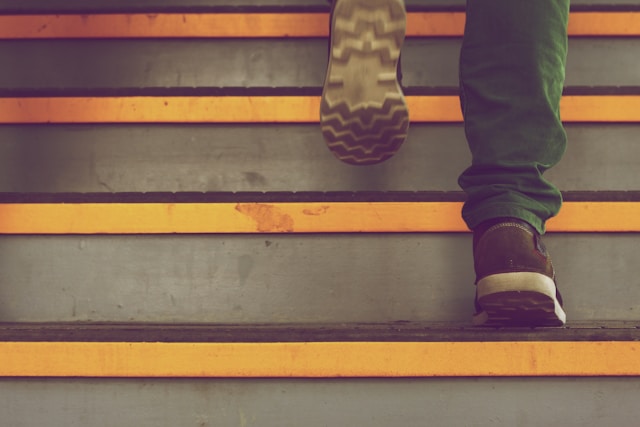 A person climbing the stairs.