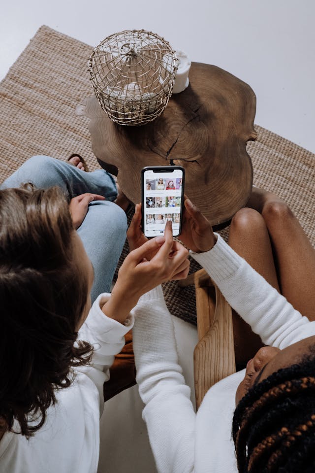 Two women swipe through TikTok videos.