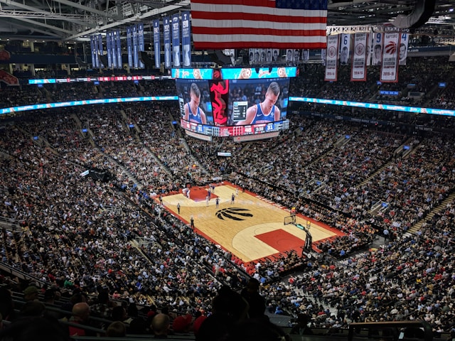 Spectators fill all the seats in a giant stadium.