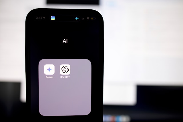An apps folder on an iPhone with the Gemini and ChatGPT apps.