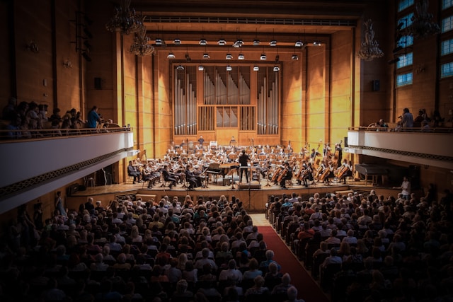 An orchestra plays for a full house.