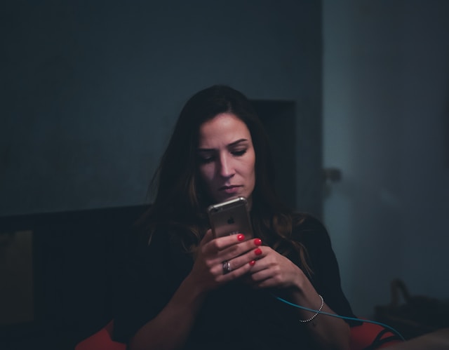 A woman looking at her phone.