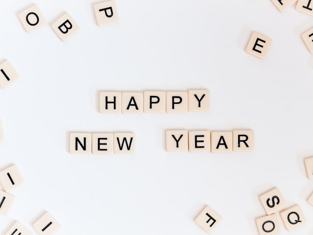Scrabble tiles spell the words “Happy New Year.”